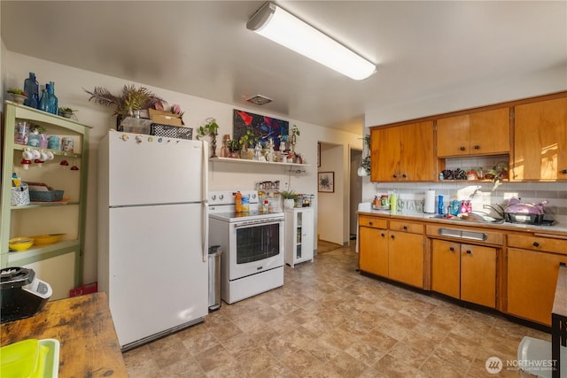 620 E Euclid Ave, Spokane, WA 99207 - kitchen featuring white appliances, open shelves, decorative backsplash, brown cabinetry, and a sink