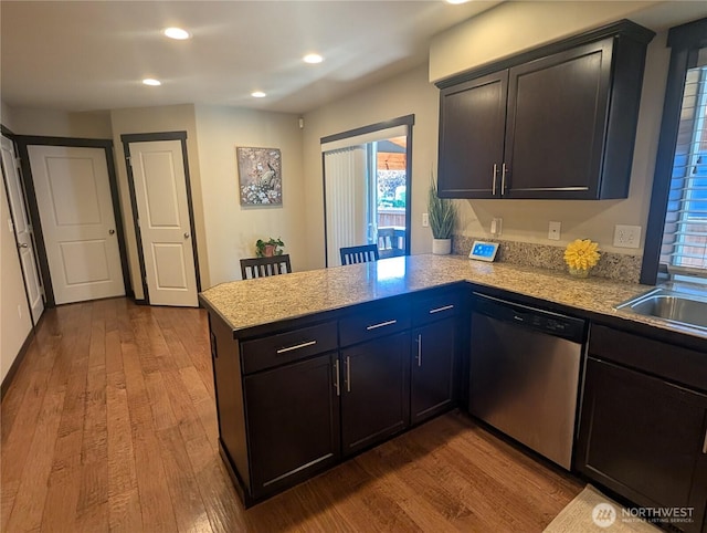 3447 Barry Pl, Mount Vernon, WA 98274 - kitchen with dishwasher, a peninsula, dark wood finished floors, light countertops, and plenty of natural light