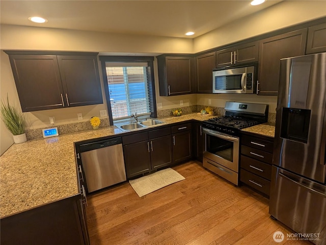 3447 Barry Pl, Mount Vernon, WA 98274 - kitchen featuring stainless steel appliances, a sink, light wood-style flooring, light countertops, and recessed lighting
