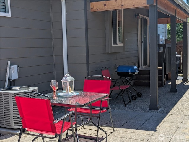 3447 Barry Pl, Mount Vernon, WA 98274 - view of patio / terrace with outdoor dining space, central AC unit, and area for grilling