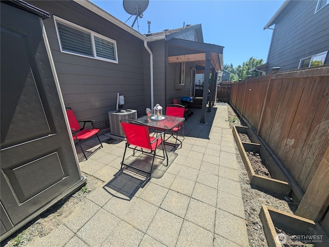 3447 Barry Pl, Mount Vernon, WA 98274 - fenced backyard with a patio, outdoor dining area, and central air condition unit