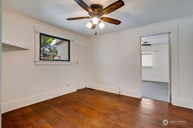 1027 E Main St, Auburn, WA 98002 - unfurnished room featuring a ceiling fan, dark wood-style flooring, plenty of natural light, crown molding, and baseboards