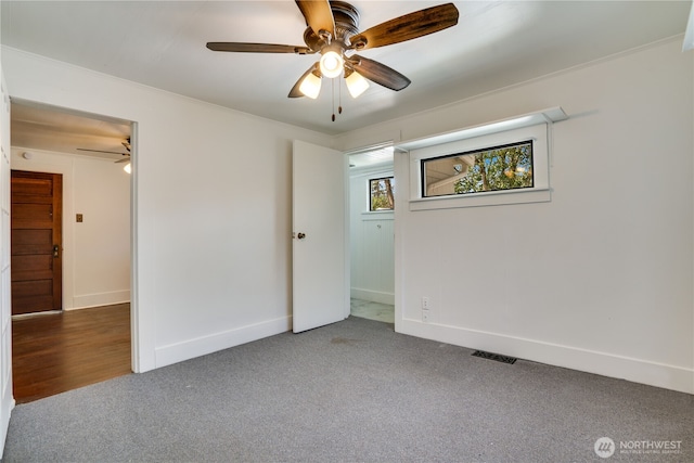 1027 E Main St, Auburn, WA 98002 - carpeted empty room with a ceiling fan and baseboards