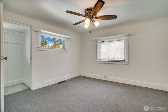 1027 E Main St, Auburn, WA 98002 - empty room with carpet, a ceiling fan, and baseboards