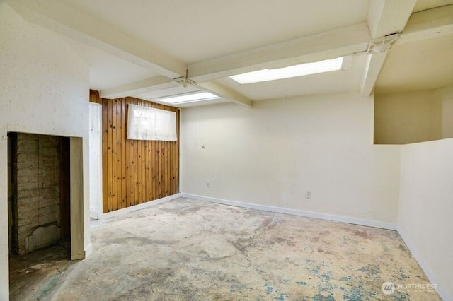 1027 E Main St, Auburn, WA 98002 - bonus room featuring baseboards, wood walls, beam ceiling, and carpet