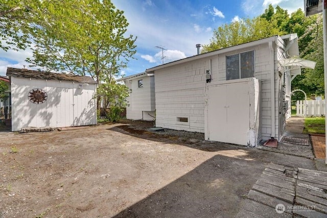 1027 E Main St, Auburn, WA 98002 - back of property featuring a storage shed and an outbuilding