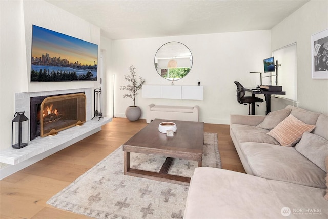 5801 Phinney Ave N Unit 103, Seattle, WA 98103 - living area with wood finished floors and a fireplace