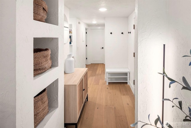 5801 Phinney Ave N Unit 103, Seattle, WA 98103 - corridor with light wood finished floors and a textured wall