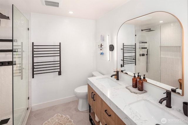 5801 Phinney Ave N Unit 103, Seattle, WA 98103 - bathroom featuring radiator, a walk in shower, toilet, tile patterned floors, and recessed lighting