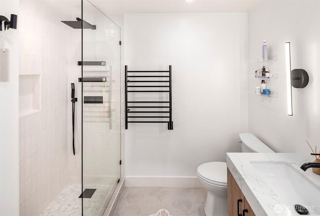 5801 Phinney Ave N Unit 103, Seattle, WA 98103 - bathroom with radiator, toilet, a tile shower, tile patterned flooring, and vanity