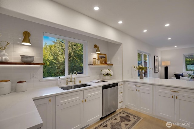 kitchen with stainless steel dishwasher, open shelves, a sink, decorative backsplash, and recessed lighting