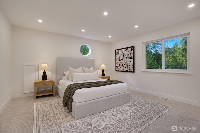 carpeted bedroom with recessed lighting, multiple windows, and baseboards