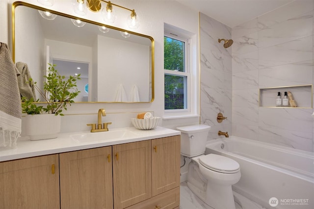bathroom featuring toilet, vanity, and shower / bath combination