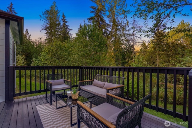 wooden deck featuring an outdoor hangout area