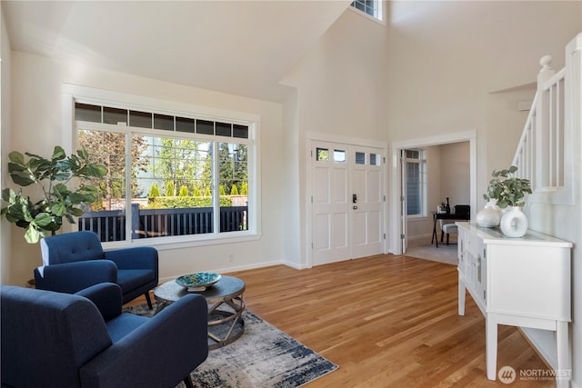 15704 124th Ave NE, Woodinville, WA 98072 - foyer entrance featuring a towering ceiling, plenty of natural light, light wood finished floors, and baseboards