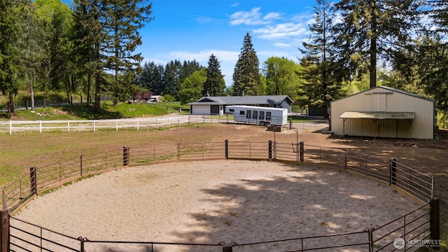 21803 NE Abernathy Rd, Yacolt, WA 98675 - view of yard with an outbuilding, an exterior structure, an enclosed horse arena, and a view of countryside