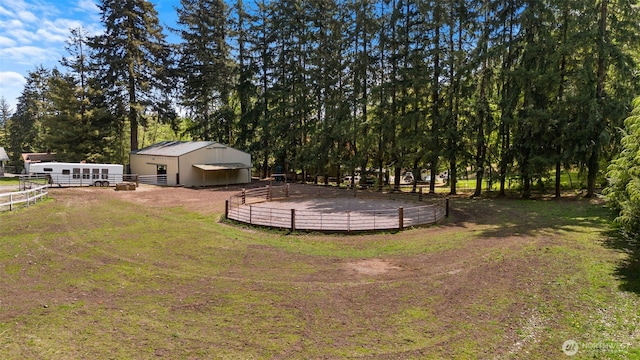 21803 NE Abernathy Rd, Yacolt, WA 98675 - view of yard featuring an enclosed riding area, an exterior structure, an outbuilding, a pole building, and fence