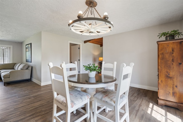 21803 NE Abernathy Rd, Yacolt, WA 98675 - dining space with wood finished floors, a chandelier, baseboards, and a textured ceiling