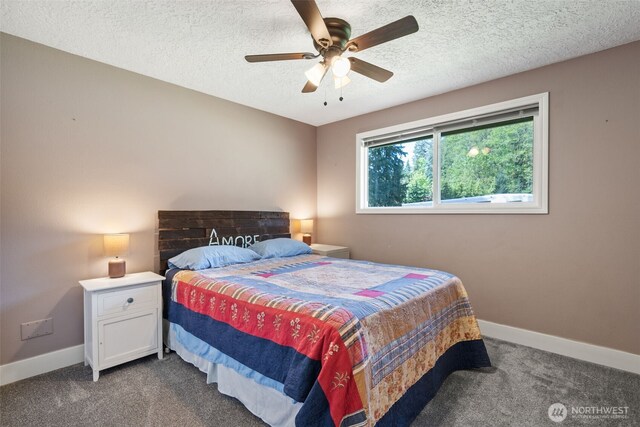 21803 NE Abernathy Rd, Yacolt, WA 98675 - bedroom with dark carpet, baseboards, a textured ceiling, and a ceiling fan