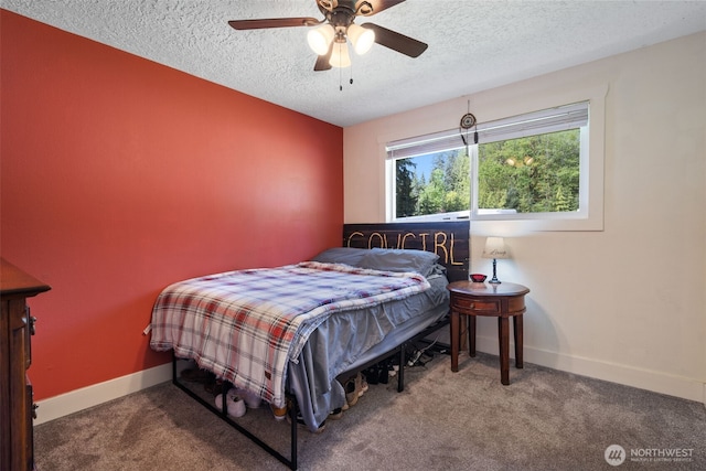 21803 NE Abernathy Rd, Yacolt, WA 98675 - carpeted bedroom featuring a textured ceiling, baseboards, and a ceiling fan