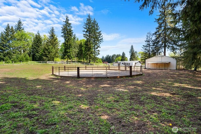 21803 NE Abernathy Rd, Yacolt, WA 98675 - view of yard featuring an outdoor riding arena, an outbuilding, and a view of countryside