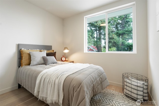 2108 15th Ave S Unit C, Seattle, WA 98144 - bedroom with baseboards and wood finished floors