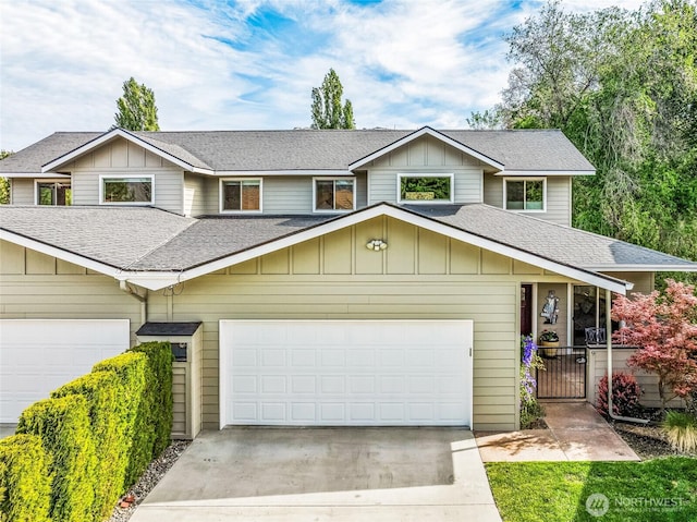 411 19th St NE Unit 9, East Wenatchee, WA 98802 - view of front of home featuring roof with shingles, driveway, and an attached garage
