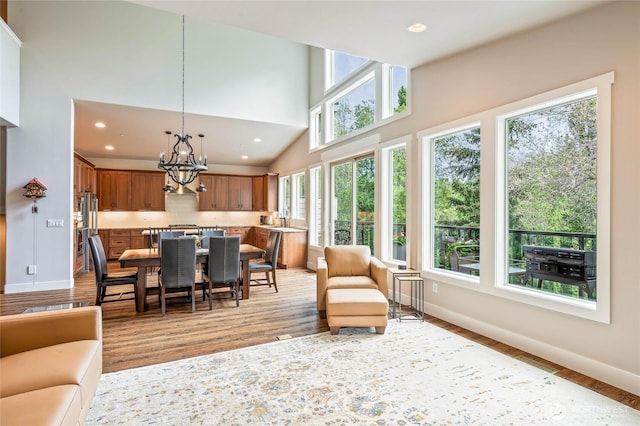 411 19th St NE Unit 9, East Wenatchee, WA 98802 - sunroom featuring a sink and a chandelier