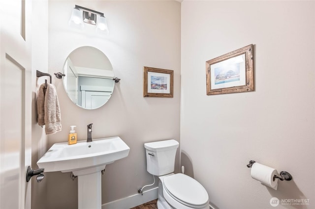 411 19th St NE Unit 9, East Wenatchee, WA 98802 - half bath featuring toilet, baseboards, and wood finished floors