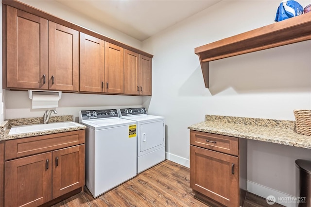411 19th St NE Unit 9, East Wenatchee, WA 98802 - washroom featuring washer and dryer, dark wood-style floors, cabinet space, baseboards, and a desk