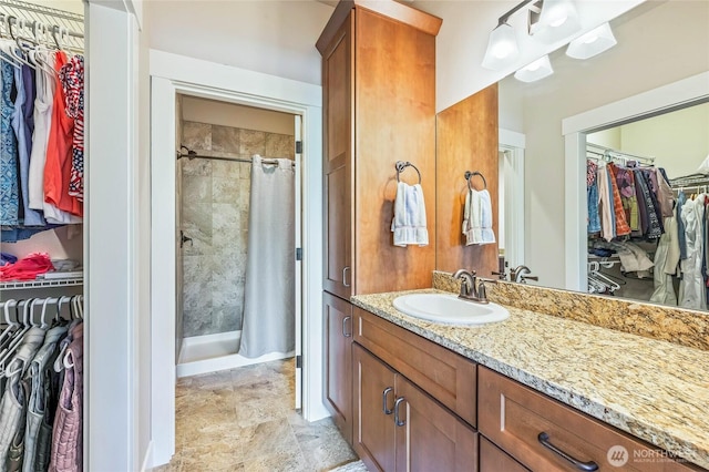 411 19th St NE Unit 9, East Wenatchee, WA 98802 - full bathroom with a stall shower, vanity, and a spacious closet