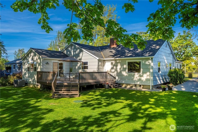 5946 S Sheridan Ave, Tacoma, WA 98408 - rear view of house featuring a deck, a chimney, a yard, central AC unit, and roof with shingles