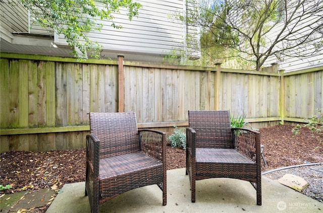 view of patio / terrace featuring fence