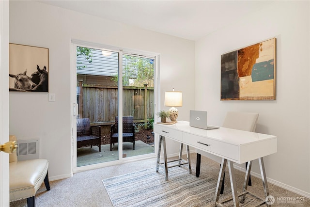 carpeted office with baseboards