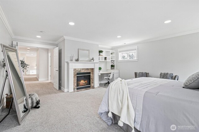 carpeted bedroom with recessed lighting, ornamental molding, a fireplace, and baseboards