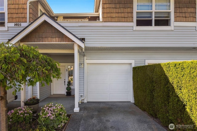view of front of home featuring an attached garage and concrete driveway