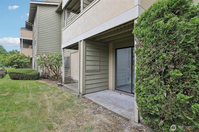 entrance to property with a yard