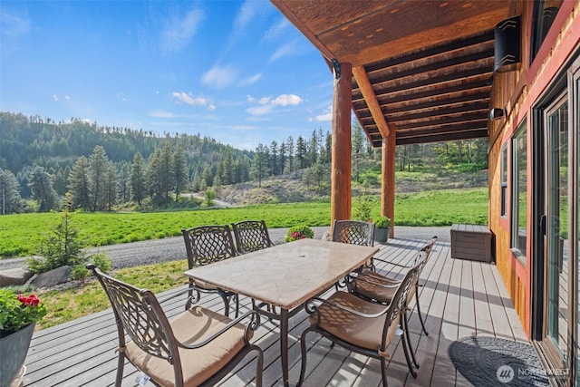 111 Connon Canyon Rd, Leavenworth, WA 98826 - wooden terrace featuring a view of trees and outdoor dining space