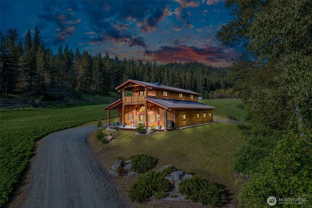 111 Connon Canyon Rd, Leavenworth, WA 98826 - view of front of home featuring a view of trees, a front yard, driveway, and a deck