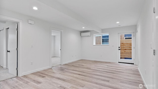 911 Hiawatha Pl S, Seattle, WA 98144 - unfurnished room featuring a wall mounted air conditioner, light wood-style flooring, recessed lighting, baseboards, and beam ceiling
