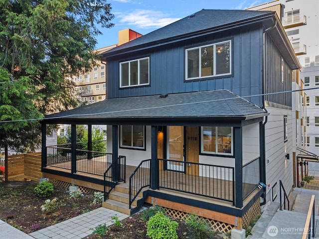 911 Hiawatha Pl S, Seattle, WA 98144 - view of front of property with board and batten siding, covered porch, and roof with shingles