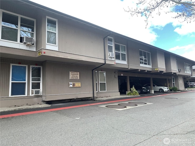view of property with covered parking