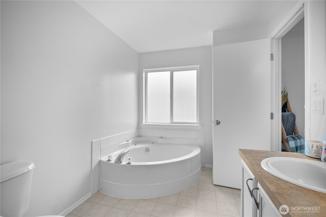 14627 81st Ave E, Puyallup, WA 98375 - bathroom featuring vanity, a garden tub, tile patterned flooring, and toilet