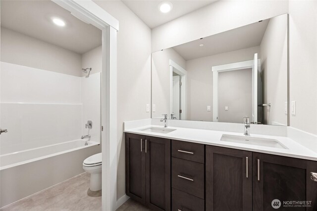 13436 NE 105th Ct Unit 17, Kirkland, WA 98033 - bathroom featuring toilet, double vanity, shower / bathtub combination, and recessed lighting
