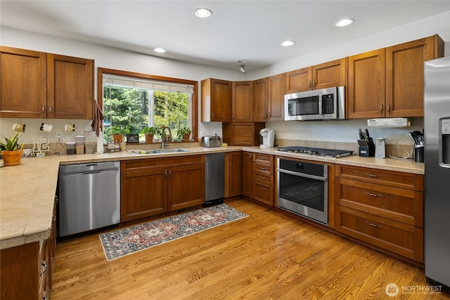 201 Double O Rd, Ronald, WA 98940 - kitchen featuring stainless steel appliances, a sink, light countertops, recessed lighting, and brown cabinets