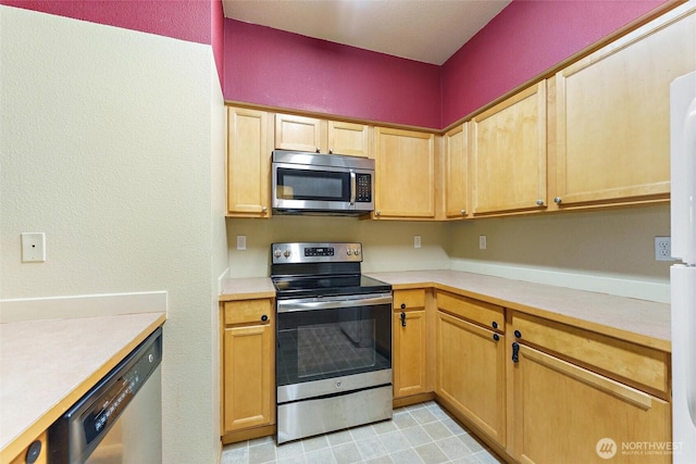 10109 186th St E Unit 249, Puyallup, WA 98371 - kitchen featuring appliances with stainless steel finishes and light countertops