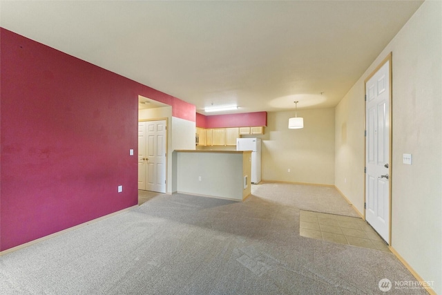10109 186th St E Unit 249, Puyallup, WA 98371 - unfurnished living room with light colored carpet and baseboards