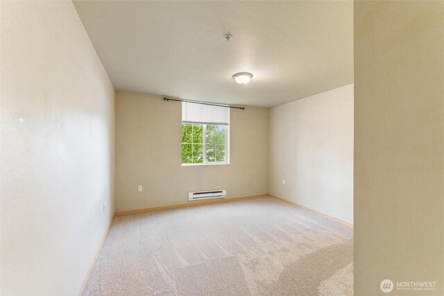 10109 186th St E Unit 249, Puyallup, WA 98371 - empty room with carpet, baseboards, and baseboard heating