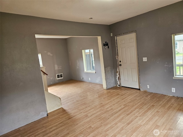 906 SW Mayer, Winlock, WA 98596 - unfurnished living room with wood finished floors and stairs