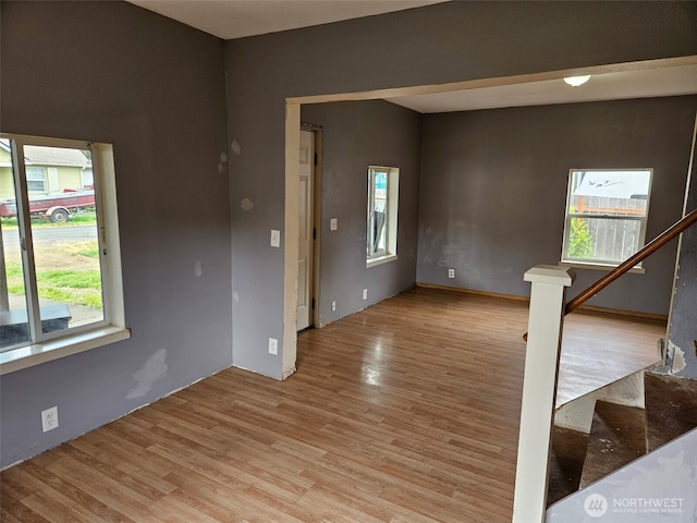 906 SW Mayer, Winlock, WA 98596 - empty room with healthy amount of natural light, light wood-style flooring, and stairs